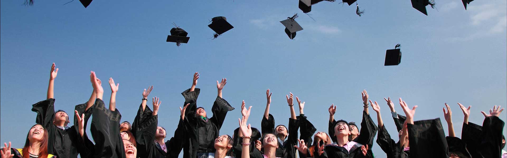 Graduates throwing hats