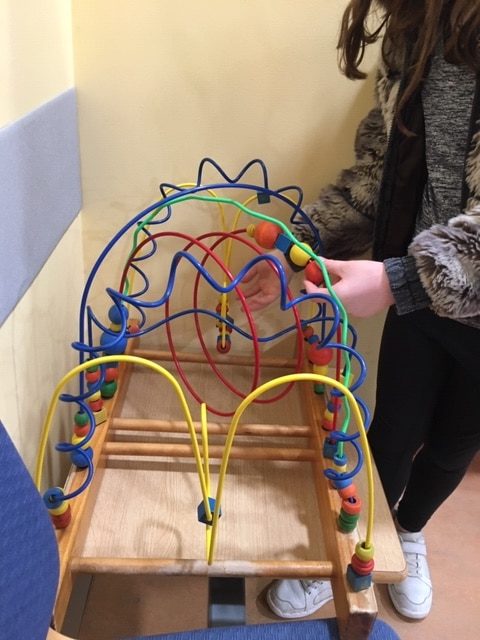 Girl Playing with Game for Fine Motor Control