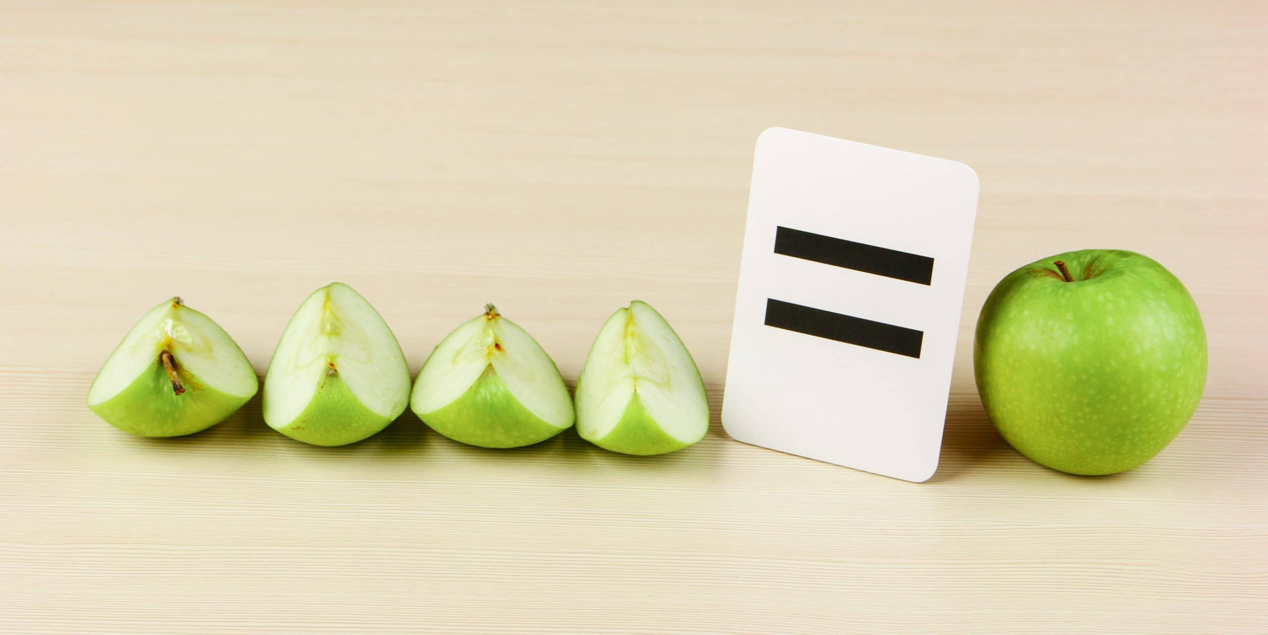 Apples cut up into quarters make a whole one