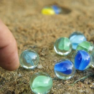 Photo of Marbles in Sand